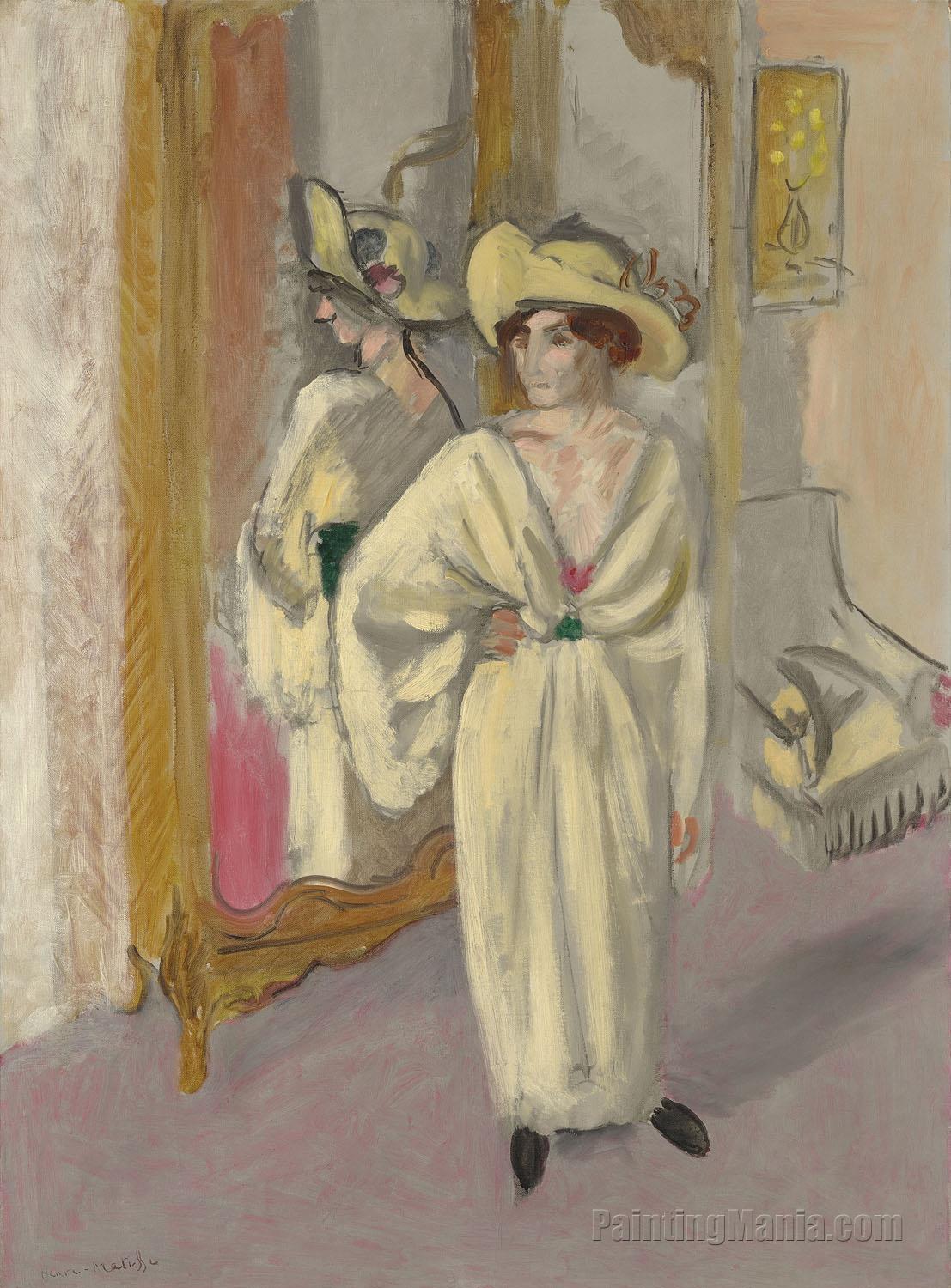 Woman in White Standing in Front of a Mirror